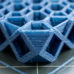 Blue 3D printed geometric lattice with hexagonal and triangular shapes