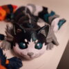 Two cat-like figures: one orange and cream, one black and white with teal eyes; other figures are behind them.